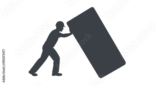 Man pushing large heavy box.