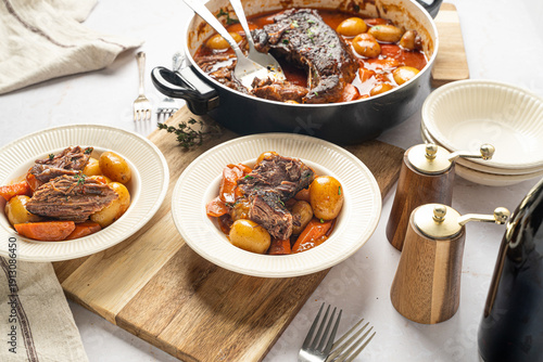 Fotografie Hearty food. Beef pot roast with roasted vegetables
