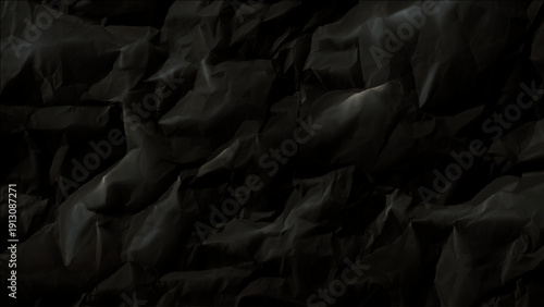 Crumpled black paper texture background with creases