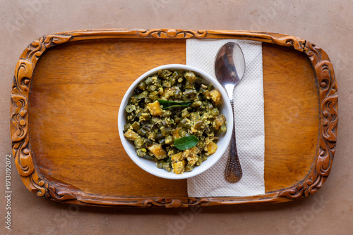 Vegetable Thoran, poriyal, palya,  with beans and coconut. A South Indian Dish. Top view close up. 