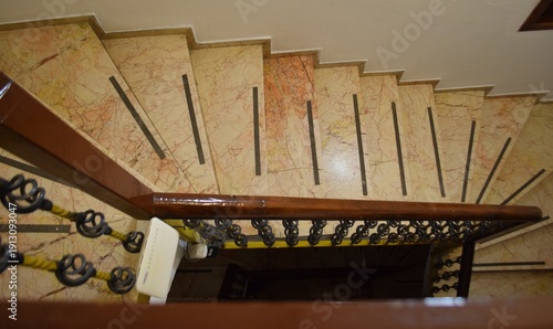 View of the circular staircase from above. Interior staircase.