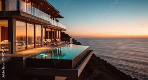 Luxurious cliffside villa at sunset, featuring an infinity pool overlooking the ocean