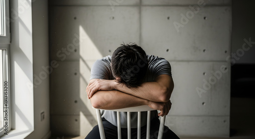 Overhead Cinematic Portrait of Man Experiencing Stress Indoors
