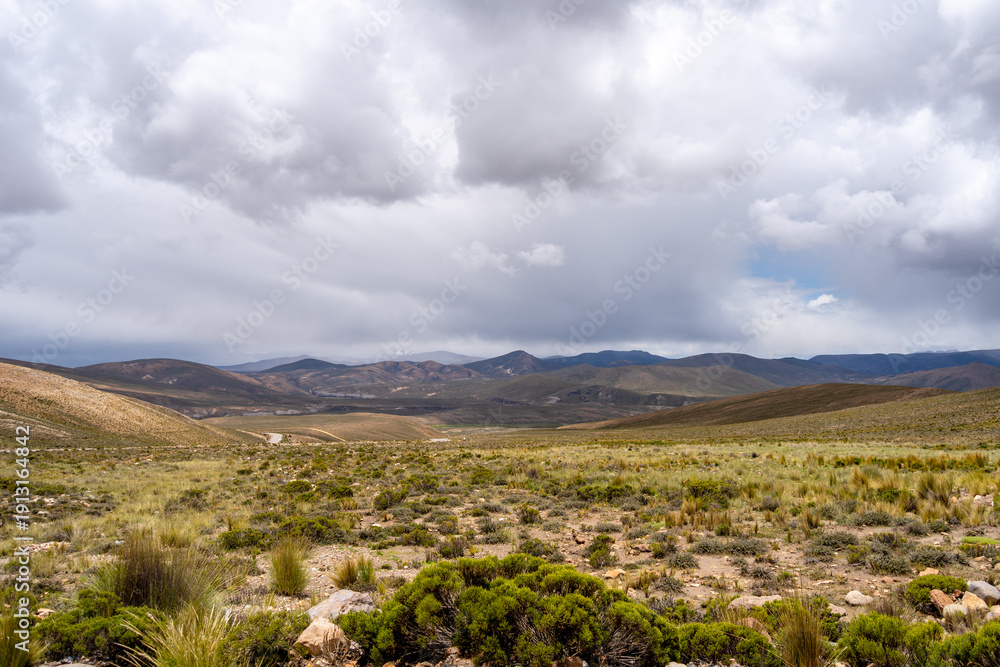 Fototapeta premium Vast valley and mountains landscape with dramatic sky, Peru