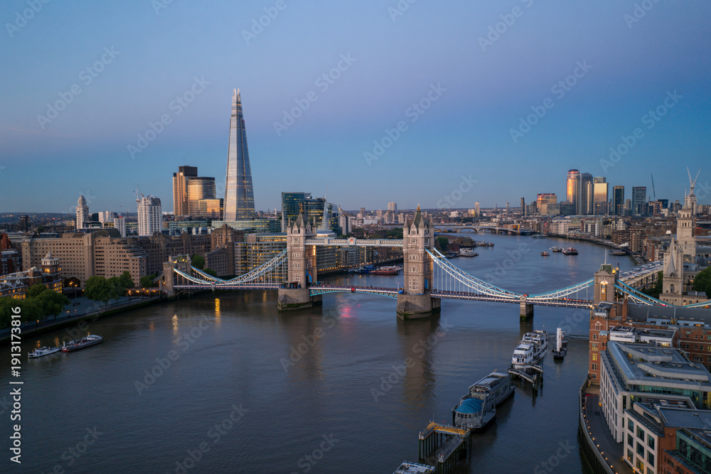 Obraz premium London skyline at dusk with Tower Bridge and The Shard illuminated over River Thames cityscape panorama