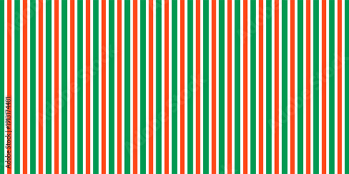Christmas seamless pattern. Red and green diagonal stripes background. Candy cane repeating decoration wallpaper. Winter holiday lines backdrop. Xmas peppermint present wrapping print design. Vector