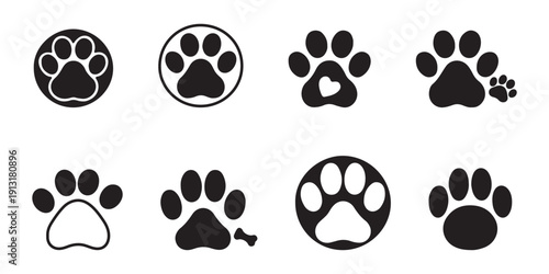 Black vector illustration of a seamless animal paw print icon pattern with cartoon dog and panda style elements and soccer ball design for decoration and sport themes