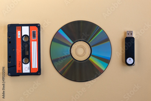 Fotografija Cassette tape, compact disc and USB flash drive on neutral background