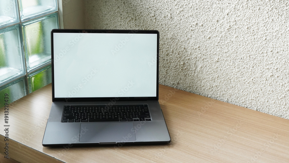 Fototapeta premium Modern Space Gray MacBook Pro Mockup on Minimalist Wooden Desk with Blank Screen