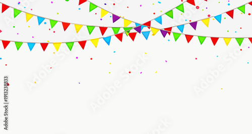 Colorful bunting flags strung across a festive, snowy outdoor scene