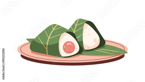 Traditional zongzi sticky rice dumplings wrapped in green bamboo leaves served on a plate for dragon boat festival.