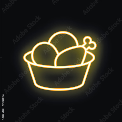 Bright yellow neon sign showing a bucket overflowing with chicken legs