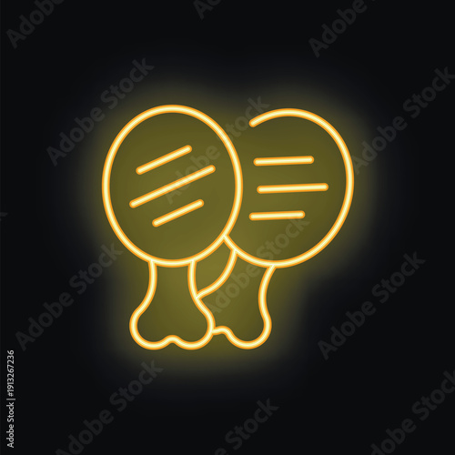 Glowing neon sign of two grilled chicken legs is shining on a black background