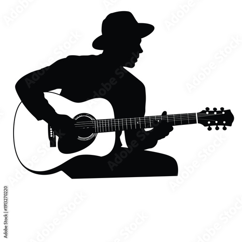 Black Silhouette of a Man Playing an Acoustic Guitar