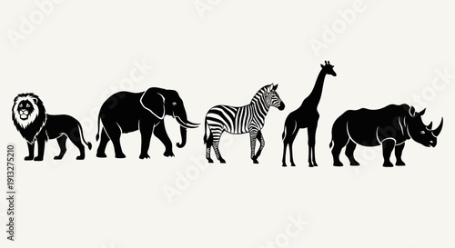 A high-resolution overhead shot of a diverse business team collaborating on a digital project around a wooden office desk featuring laptops and modern workspace accessories