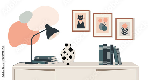 Stylish and modern interior scene with a desk lamp, books, and a vase on a console table against a wall with framed art.