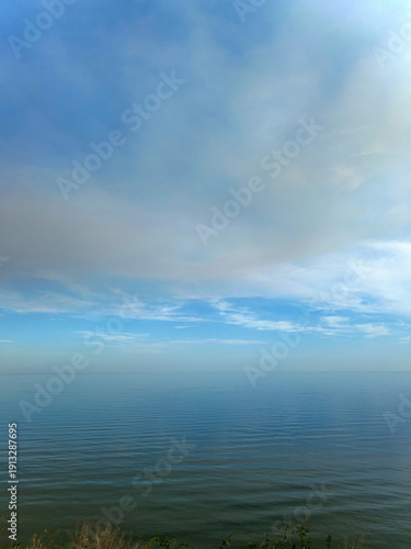 Serene Seascape View with Calm Waters and Cloudscape, Capturing Tranquility and Vastness of Ocean and Sky, Horizon Line