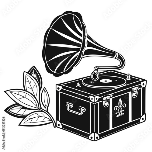 Vintage gramophone with a flower next to it