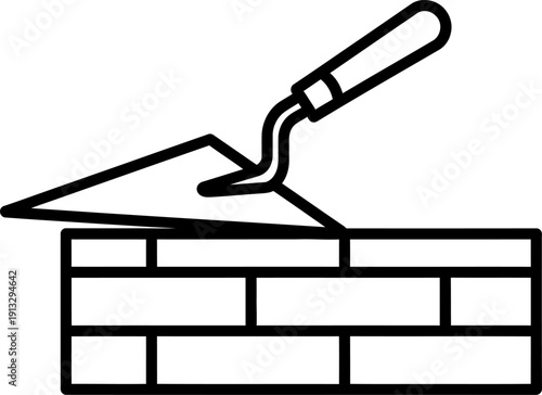 Trowel on top of a brick wall construction tool