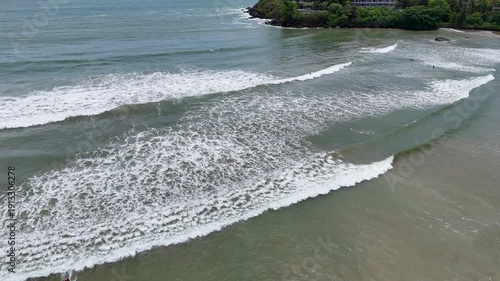 Galle, Sri Lanka, November 3, 2025: Devata Beach in the galle city and surfers riding in the waves