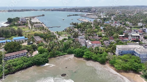 Galle, Sri Lanka, November 3, 2025: Devata Beach in the galle city and surfers riding in the waves