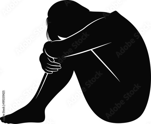 A distressed person sits alone in a state of emotional despair and hopelessness quietly