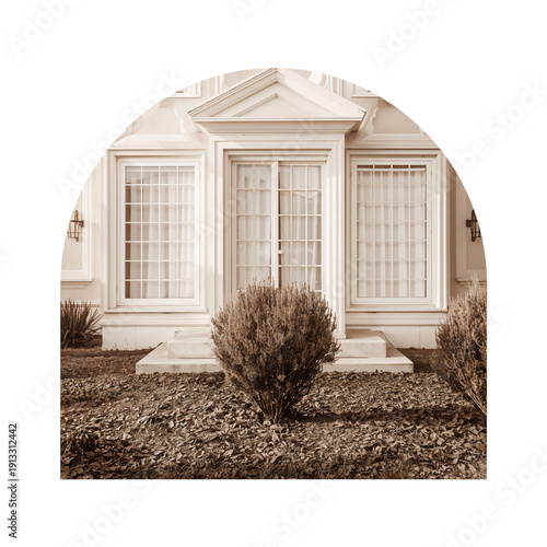 Front View of a House With Windows and Shrubs During Daylight Hours