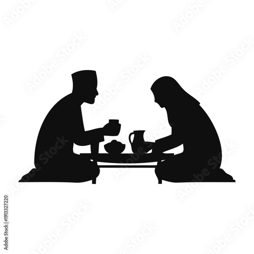 Silhouette Muslim Couple Sharing Iftar or Suhoor Meal During Ramadan