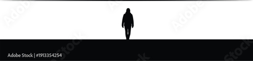 Silhouetted figure walks towards a vast white space with a minimalist background