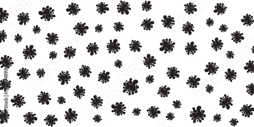 Scattered organic abstract shapes in black and white on a white background