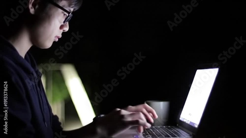 Over-the-shoulder, A student typing furiously on a laptop late at night, the screen glow illuminating their face, coffee steam rising in the foreground.