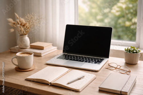 Wallpaper Mural Modern workspace featuring a laptop, notebooks, coffee cup, and decorative plants on a wooden desk near a window with natural light illuminating the scene Torontodigital.ca