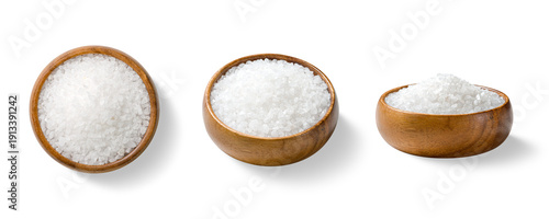 Tableau sur toile Three piles of coarse sea salt crystals in a wooden bowls, shown from top and side views, isolated on a transparent background