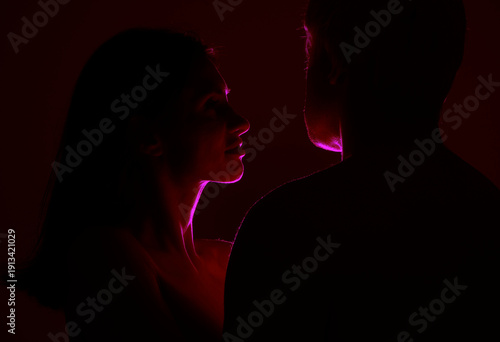 silhouette couple love. Couple in love. Man and woman posing studio. Romantic. Sensual. Beauty. Background. Model. 