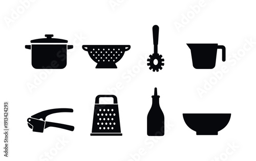 Home pasta cooking tools: stockpot, colander, pasta spoon, measuring cup, garlic press, cheese grater, olive oil bottle, serving bowl.
