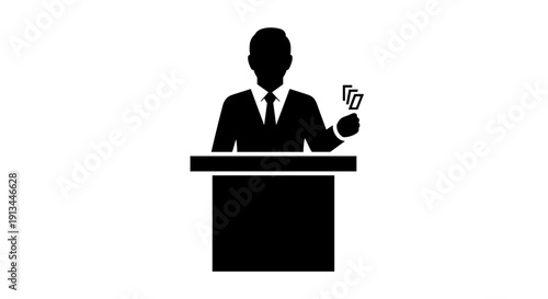 Man in suit speaking at podium.