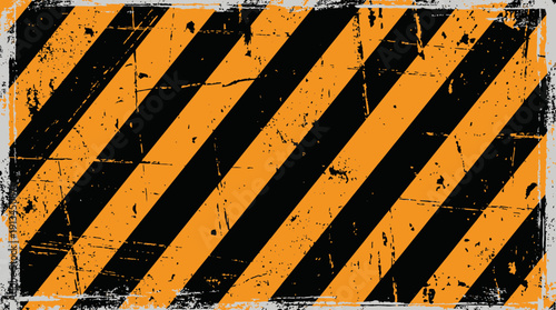 Grungy orange and black diagonal warning stripes texture with distressed weathered effect, concept for industrial safety awareness, construction site sign and hazard zone identification