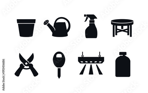 Indoor plant care items: plant pot, watering can, spray bottle, plant stand, pruning shear, moisture meter, grow light, fertilizer bottle.
