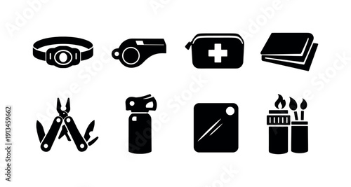 Outdoor camping safety items: headlamp, whistle, first aid pouch, emergency blanket, multi tool, bear spray canister, signal mirror, waterproof match case.