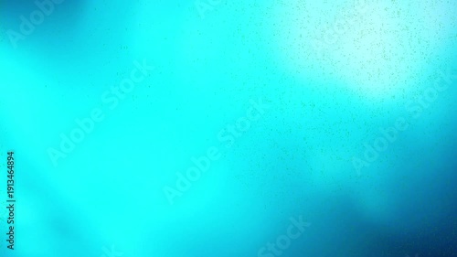 film burn transition with blue and cyan light leak effects, ideal for adding a vintage or dramatic feel to video edits. This visual element is perfect for transitions and overlays.