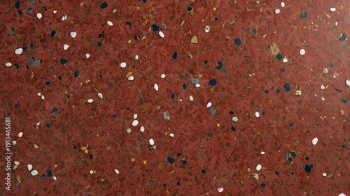 A terrazzo red surface with a polished concrete look, blending marble and granite chips to create a smooth, decorative texture. Ideal for floors, walls, and modern interior finishes.