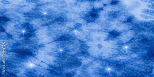 An abstract blue background featuring water-like textures and bright sunlight streaming through fluffy white clouds in a clear summer sky