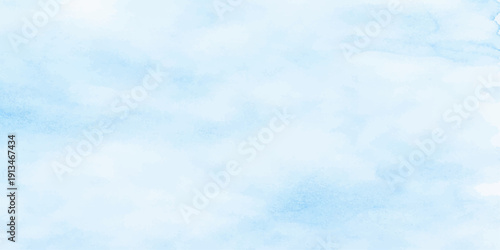 A beautiful summer day features a clear blue sky filled with fluffy white cumulus clouds across a natural sunny atmosphere