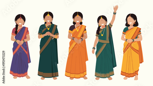 Group of five young indian girls wearing traditional colorful silk saris and gold jewelry standing together in a row against a light background.