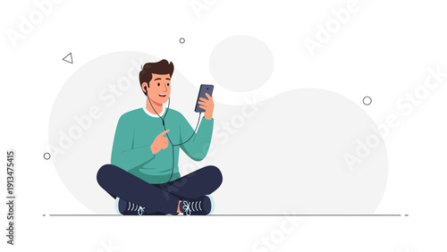 Young man with headphones listening to music on smartphone, sitting cross-legged