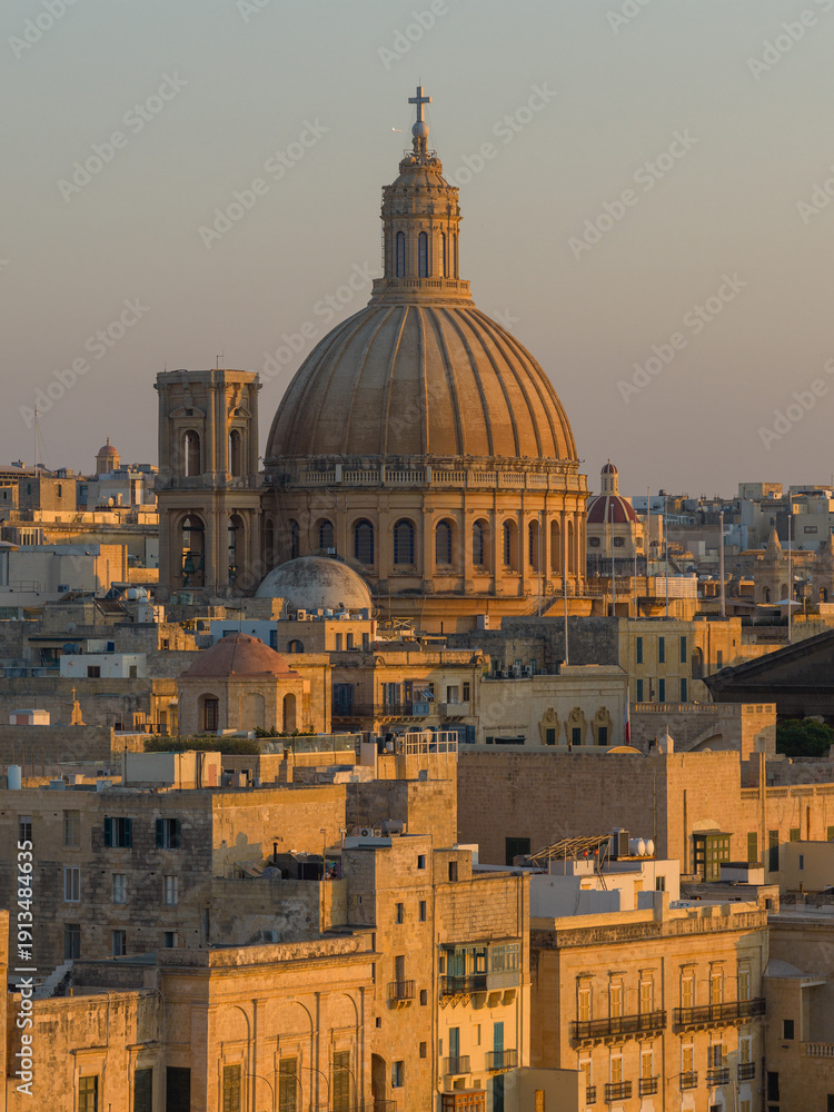 Obraz premium Basilica Sanctuary of Our Lady of Mount Carmel dome at sunset - Valletta, Malta