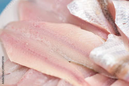 A plate of fresh 'Banji-hoe' (Raw Large-eyed Herring). Banji is a local specialty similar to Baendaengi but known for its richer taste and softer texture.