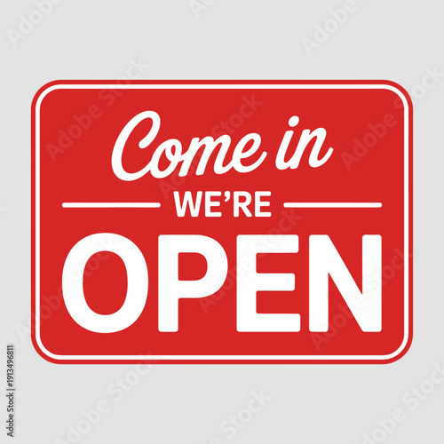 A red sign displays the message come in we re open in white