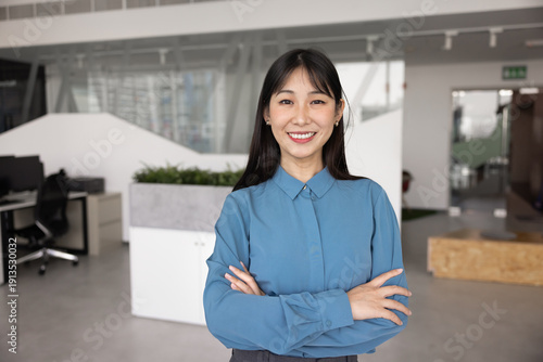 Obraz na plátně Happy confident young 20s Asian business woman keeping hands crossed in confiden