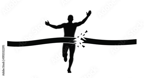 Silhouette of Athlete Breaking Through Finish Line Tape in a Race Celebration